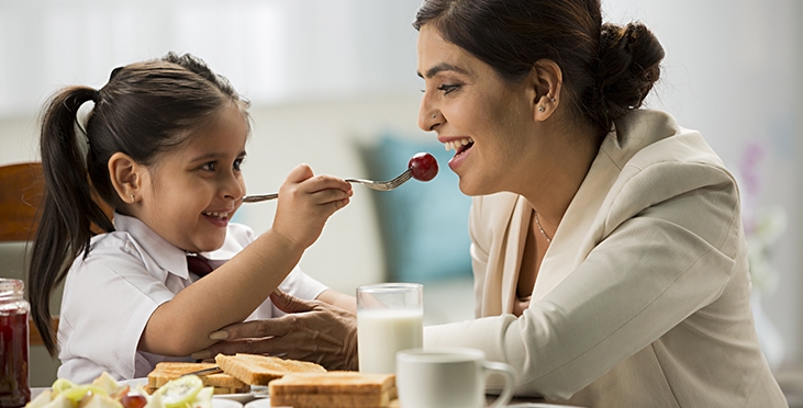 Daughter is feeding her mother