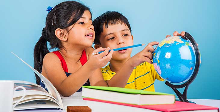 Kids looking at world map