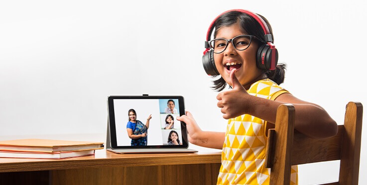 A girl with headphones & iPad